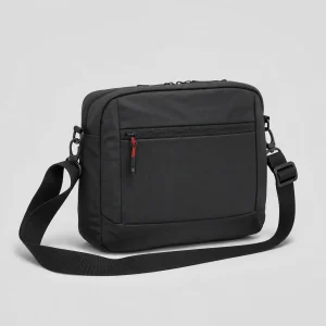 Black utility crossbody bag on a clean studio background